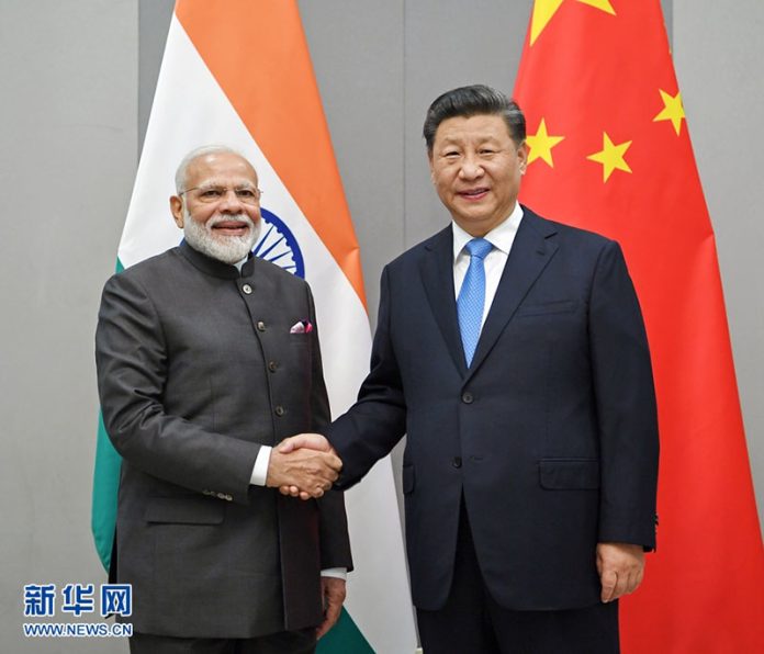 外界認為，習近平若缺席G20很可能是故意不給印度總理莫迪面子。圖為兩人2019年在巴西的會面。圖/取自新華社