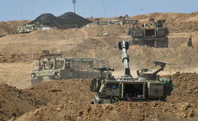 在加薩邊境以色列一側拍攝集結的以軍部隊。圖／新華社